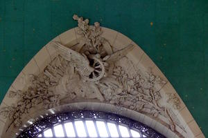 Sculpture of winged wheel in niche of Grand Central