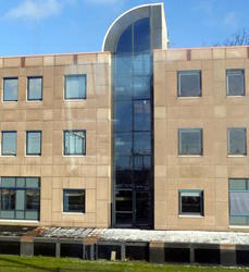 Building with windowed section topped by quarter circle