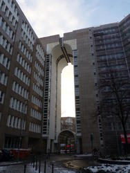 Nine-story arch between two sections of a building.Inside the arch is another arch for just the ground floor