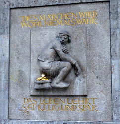 Man pooping coins; legend says “This fairy tale will never come true; life teaches us to be clever and save money”