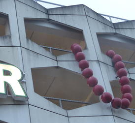 purple beads on parking garage