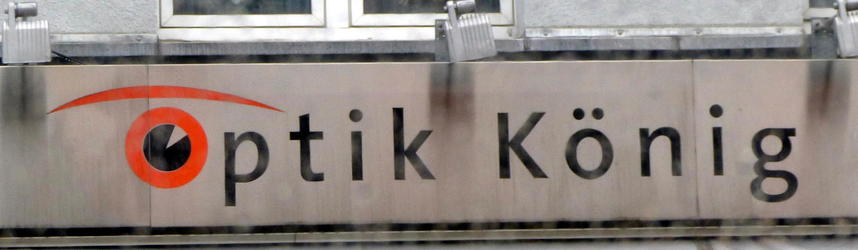 Logo for Optik König glasses store; first O is in shape of an eye with an eyebrow.