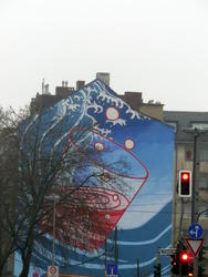 Bubbling glass of water painted on side of building