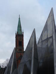 Old church in background; modern sculpture in foreground