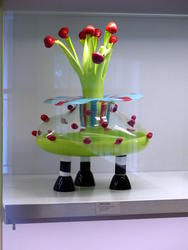 3-legged object with green stalks and red mushroom-like tops