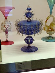 Blue glass dish with many small clear glass protrusions