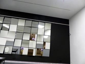 Room with wall lined with mirrors