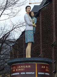 statue atop kiosk