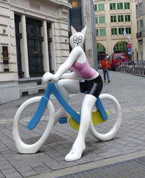 cartoony cat on bicycle