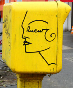 Line drawing of woman’s face; has an art deco vibe. Name “luew” is part of the drawing.
