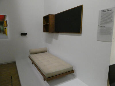 bed and cabinet on wall