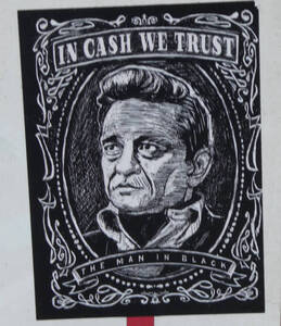 Johnny Cash drawn in style of portraits on US currency; text reads “In Cash We Trust / The Man in Black”