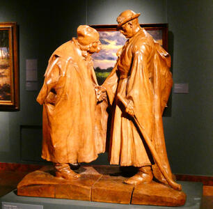 wooden sculpture of two men