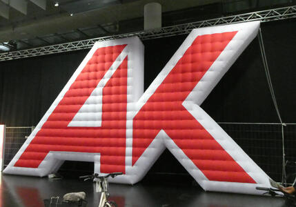 Large red inflatable version of the Arbeiterkammer logo (AK)