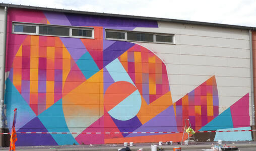 Abstract geometric shapes in orange, blue, and purple shades
