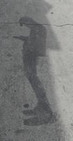 Painting of “shadow” of a man looking at cell phone.
