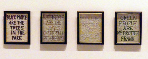 Small frames with text about different colors of people