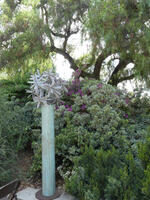 Green-patina column with gray sculpted leaves