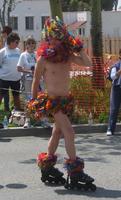 Roller skater in rainbow scarf and tutu