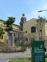 Park with colonial building in foreground and church dome in background