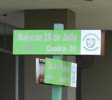 Low contrast silver on green sign