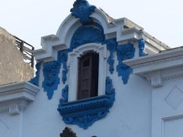 Blue scrollwork around window