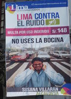 Sign with man holding hands over ears