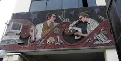 Reliefwork of scientists at work