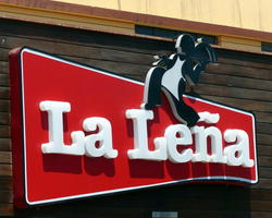 Sign for restaurant with waiter carrying tray