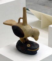 ceramic bird atop frog
