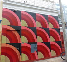 Series of arcs painted on front of building