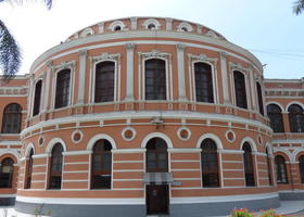 Cylindrical section of pink building