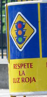 Sign with traffic signal: “Respect the red light”
