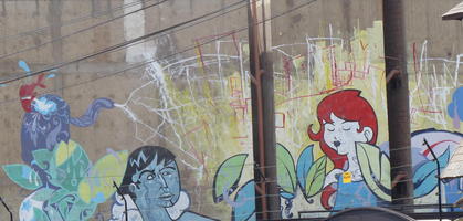 Wall painting of man and woman among plants.