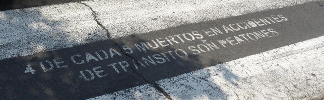 Sign stenciled onto pedestrian crosswalk