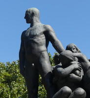 Standing man and seated women