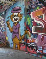 “Top Cat” cartoon character holding marijuana cigarette; shirt reads “Top Buzz”