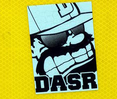 Grimacing man with baseball cap & sunglasses