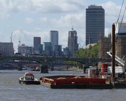 Small boat in foreground, skyline in background