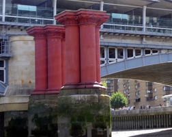 Four red stone columns