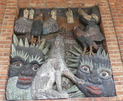 Painted wood carving of norse mythological creatures