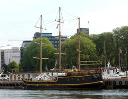 Three-masted ship in harbor