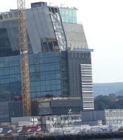 Building with black and white stripes like a barcode on the side