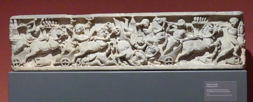 Stone carving of circus race