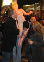 Man carrying inflatable sex doll on his shoulders