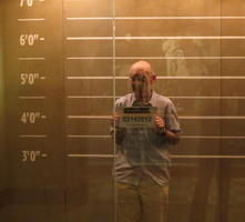 Me holding a “jail number” placard in a lineup