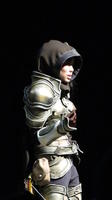 Woman in armor wearing hood