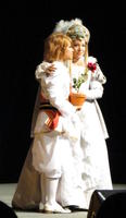 Man and woman in white outfits