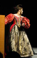 Woman in flowered dress with red striped top