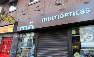 Sign for optometrist, with neon glasses and half-cut-off letters